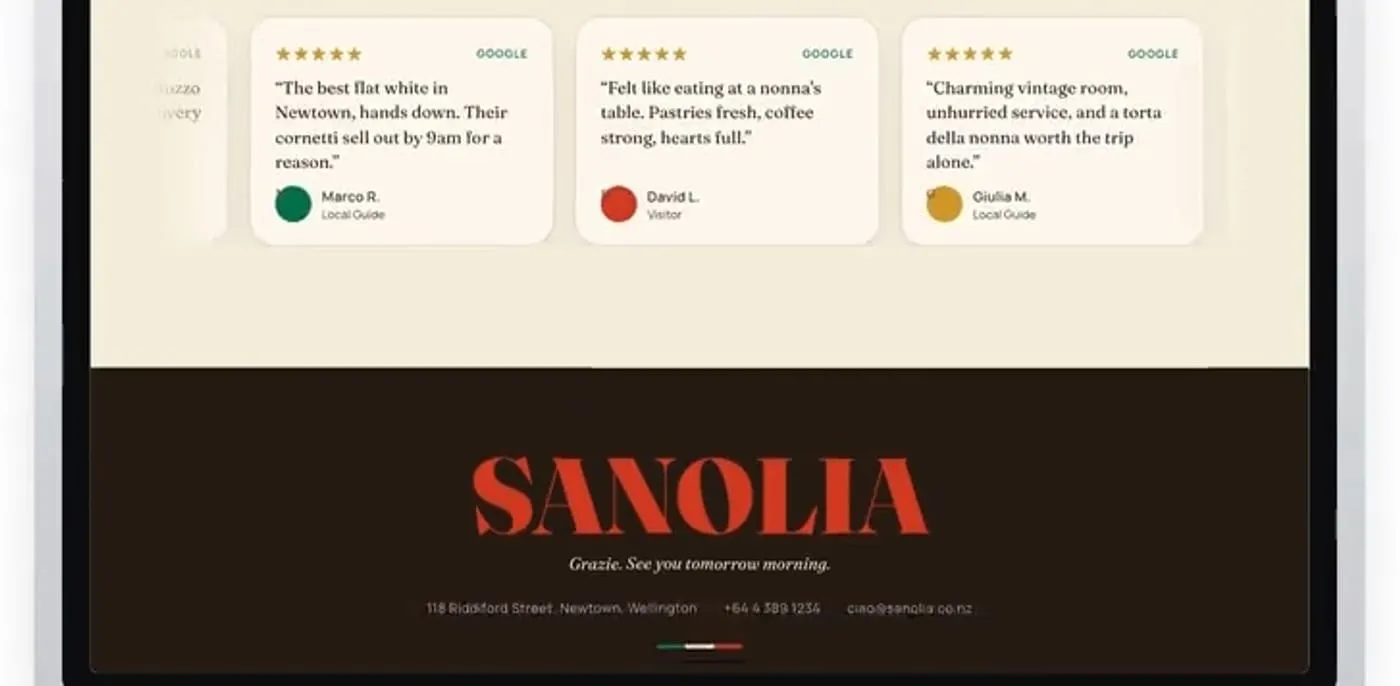 Review cards above the dark footer